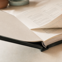 AI-assisted concept close-up of the hardcover binding and page block